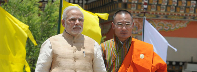 Prime Minister, Narendra Modi with the Prime Minister of Bhutan, Lyonchhen Tshering Tobgay, during the ceremonial reception, at Paro International Airport, in Bhutan