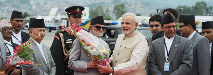 Prime Minister, Shri Narendra Modi being received by the Prime Minister of Nepal, Shri Sushil Koirala on his arrival, at Tribhuvan International Airport, Kathmandu, Nepal