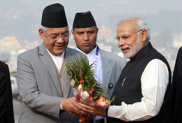 Prime Minister Narendra Modi being received on his arrival at Tribhuvan International Airport, Kathmandu, to attend the 18th SAARC Summit