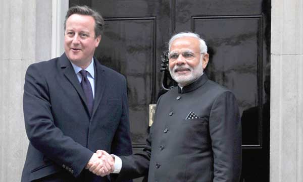 The Prime Minister, Narendra Modi and the Prime Minister of United Kingdom (UK), David Cameroon, at the Drum (Treasury Quadrangle), in London.