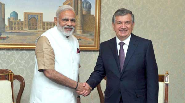 Prime Minister, Narendra Modi in a brief meeting with the Prime Minister of Uzbekistan, Shavkat Mirziyoev, in Uzbekistan