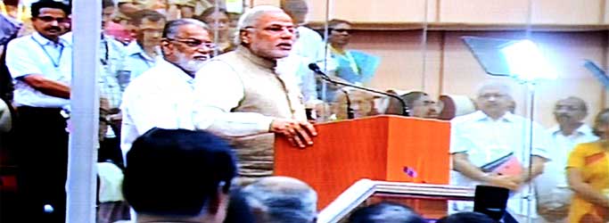The Prime Minister, Narendra Modi addressing after the successful launch of PSLV - C 23, at Sriharikota, in Andhra Pradesh on June 30, 2014. The ISRO Chairman, Dr. K Radhakrishnan is also seen.