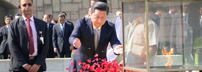 The Chinese President, Xi Jinping paying floral tributes at the Samadhi of Mahatma Gandhi, at Rajghat, in Delhi on September 18, 2014.