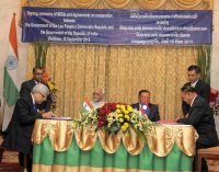 Vice President, Mohd. Hamid Ansari and the Vice President of Lao PDR, Bounnhang Vorachith witnessing the signing of an agreement