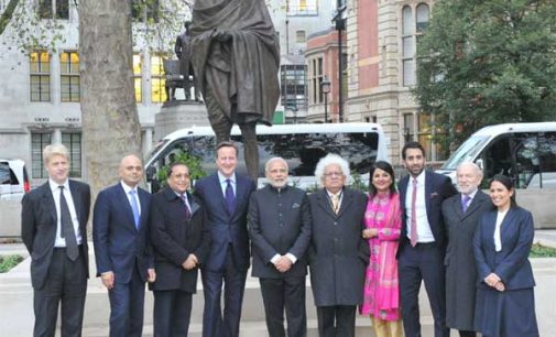Prime Minister, Narendra Modi in a group photograph after paying homage at the statue of Mahatma Gandhi